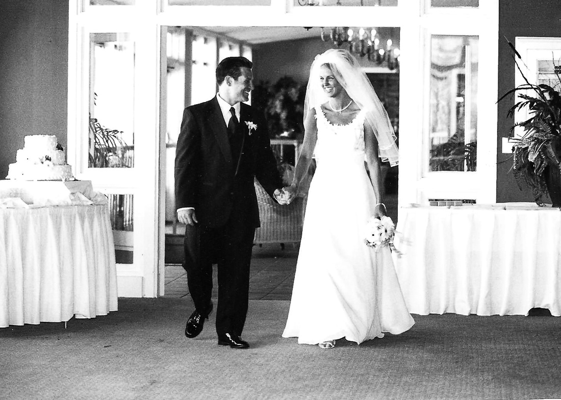Bride and Groom walking into the reception