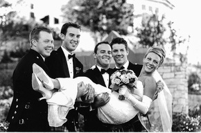 Groomsmen holding the Bride